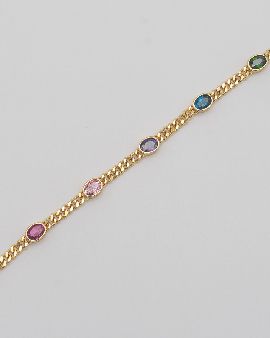 Goldenes Panzerarmband mit bunten Steinen — Detail