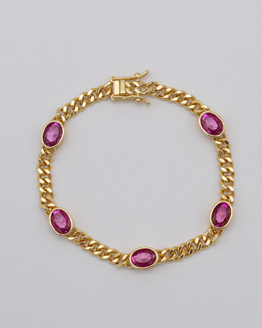 Goldenes Panzerarmband mit pinken Steinen