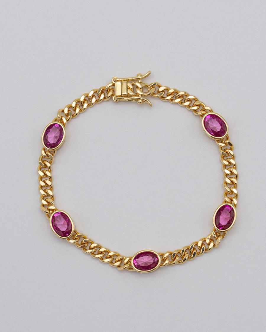 Goldenes Panzerarmband mit pinken Steinen